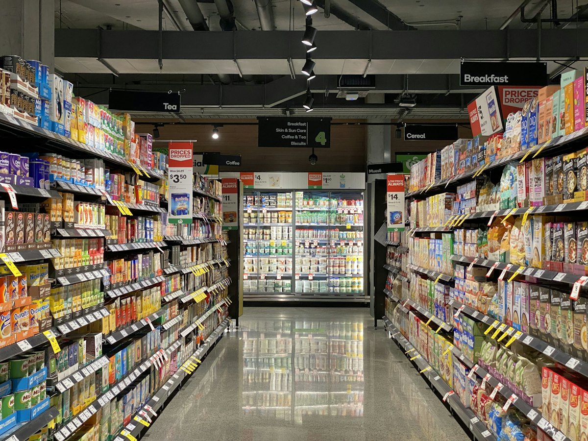 Supermarket aisle stocked with products